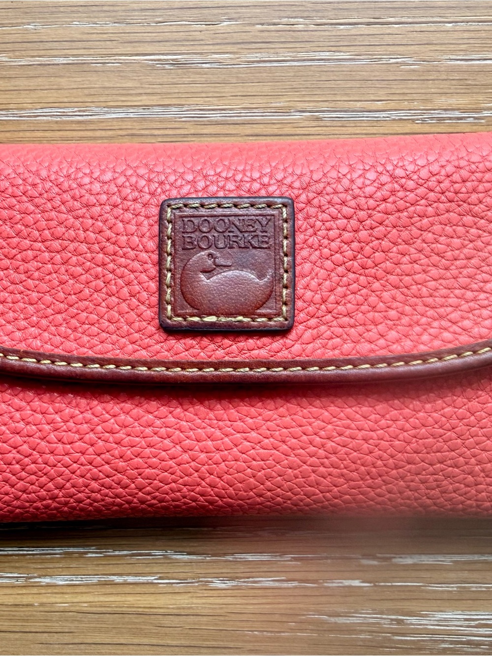 Dooney & Bourke Coral Pebbled Leather Continental Wallet with Brown Trim